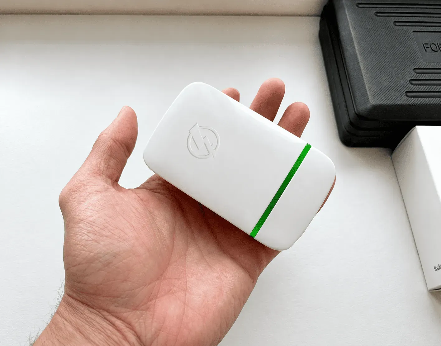 StopWatt device held in a hand